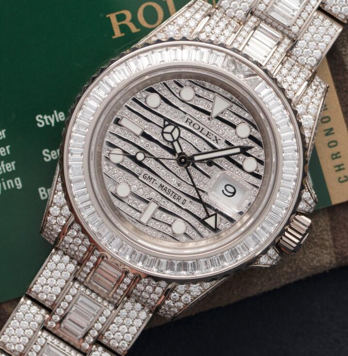 The diamonds paved on the Rolex make it more precious.